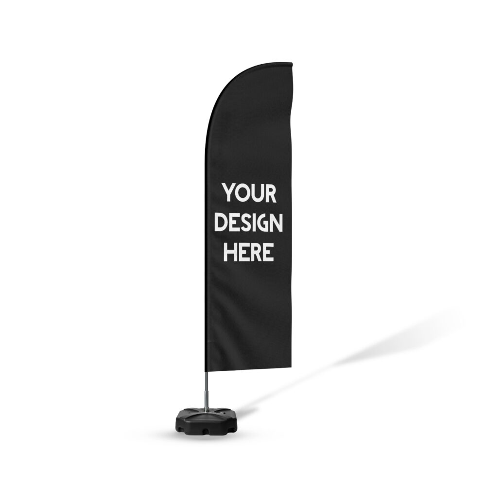 Black beach flag mockup with vertical 'Your Design Here' text in white, standing on a weighted base, demonstrating customizable feather banner printing for outdoor advertising.