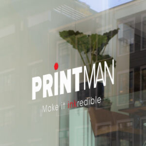 Shopfront window sticker mockup featuring the Printman logo with 'Make it inkredible' tagline on a glass window, ideal for custom branded decals.